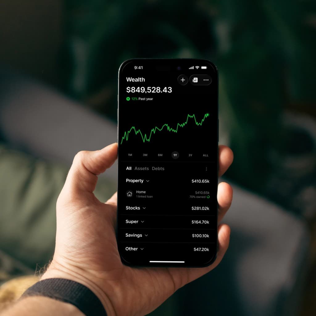 Gather wealth dashboard on a phone in hand