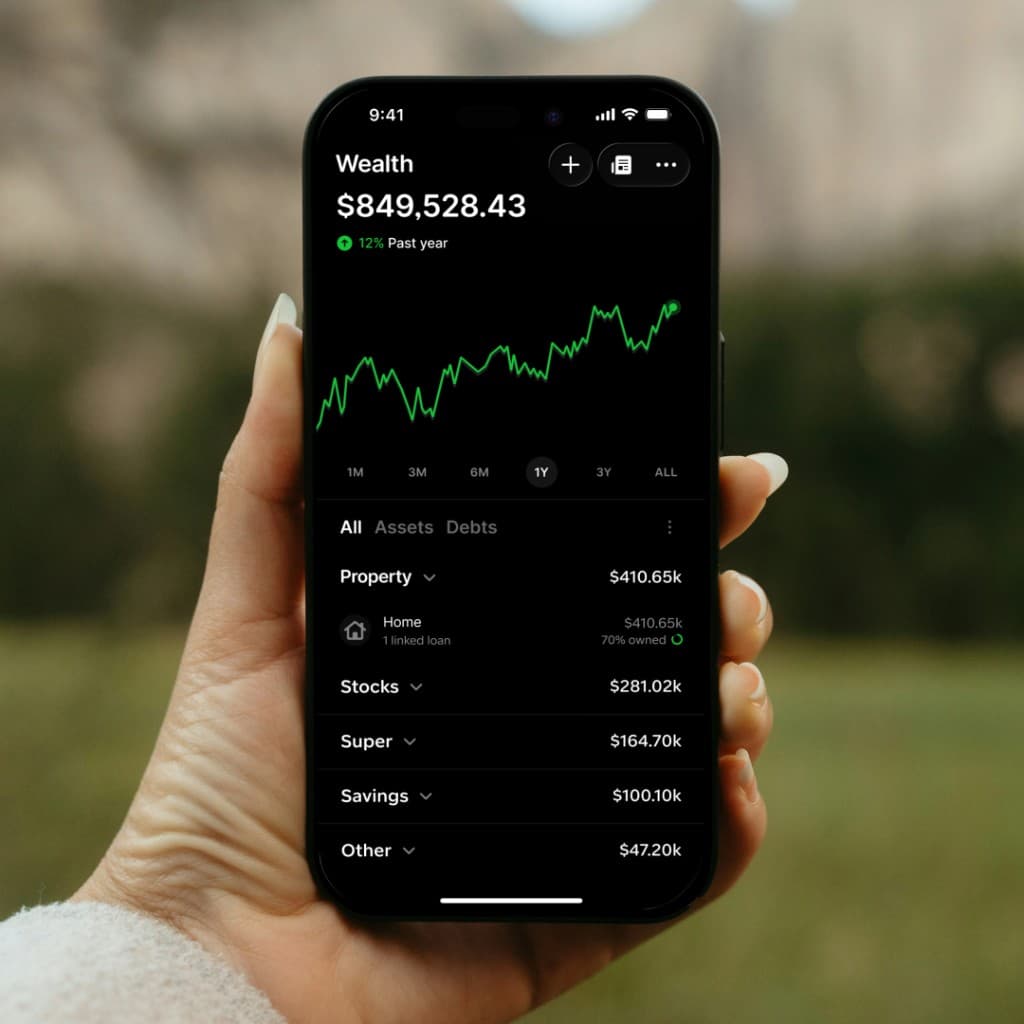 Gather wealth dashboard on a phone in hand