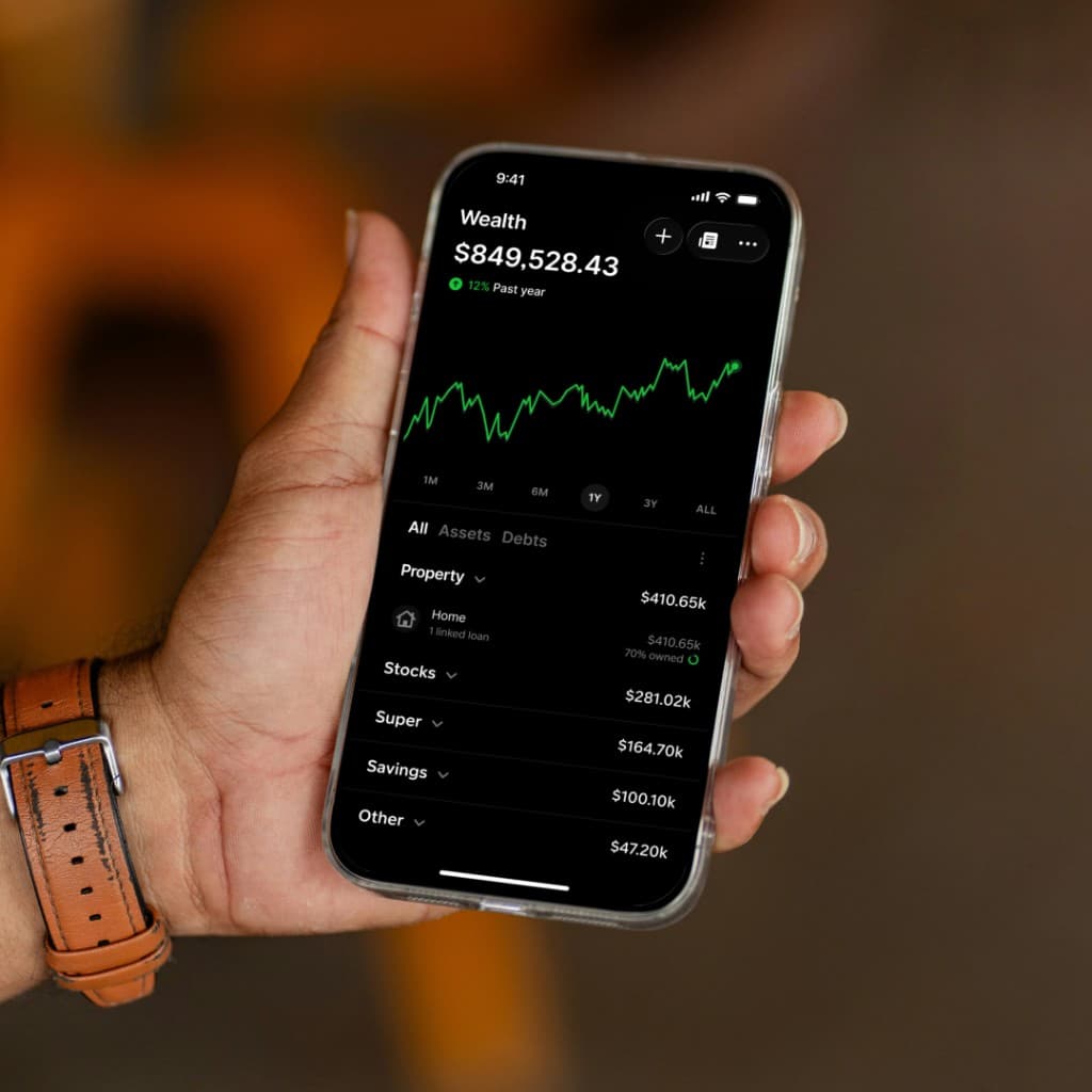 Gather wealth dashboard on a phone in hand